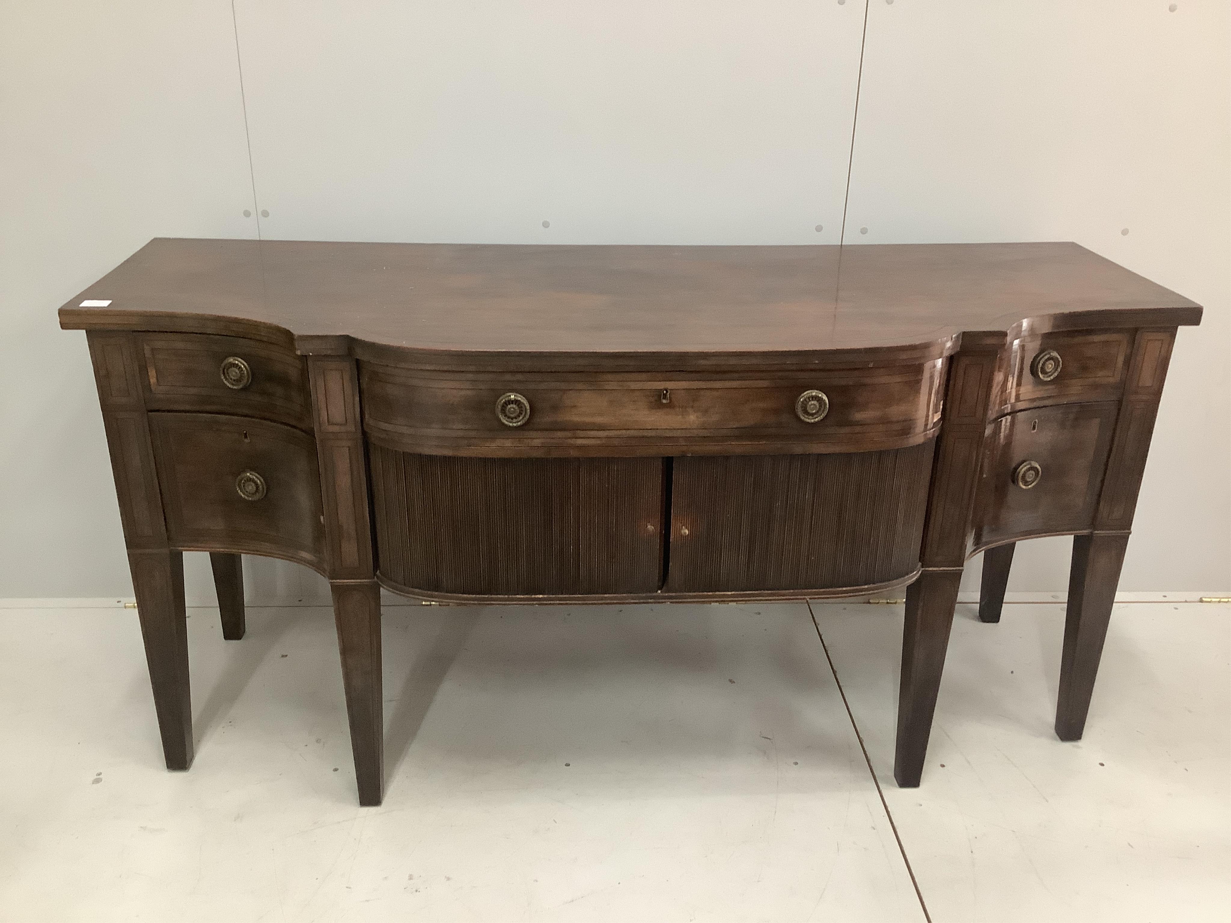 A George III mahogany bow front sideboard, width 183cm, depth 69cm, height 88cm. Condition - fair